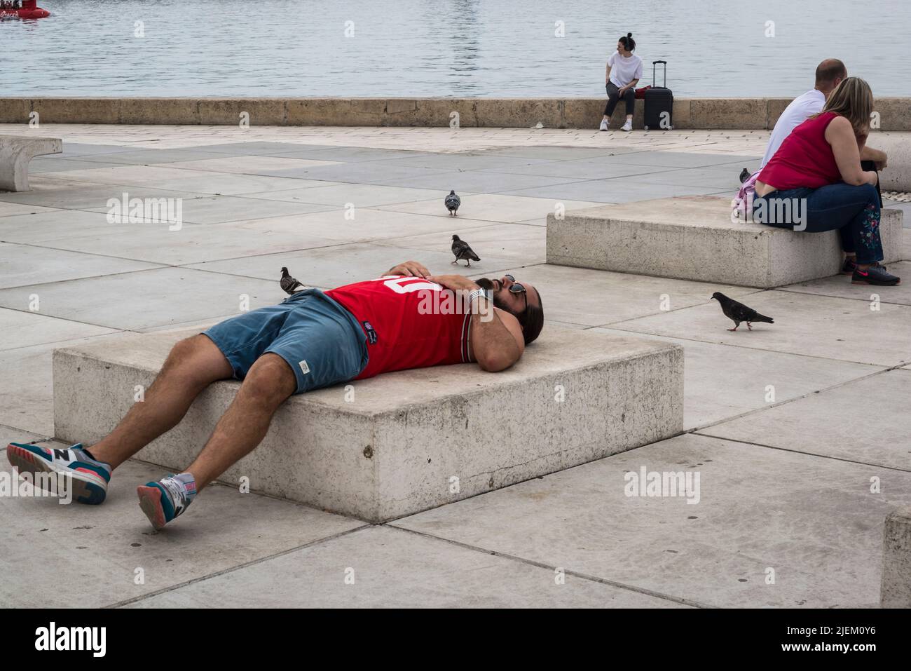 Man resting on the Riva promenade, Split, Croatia Stock Photo