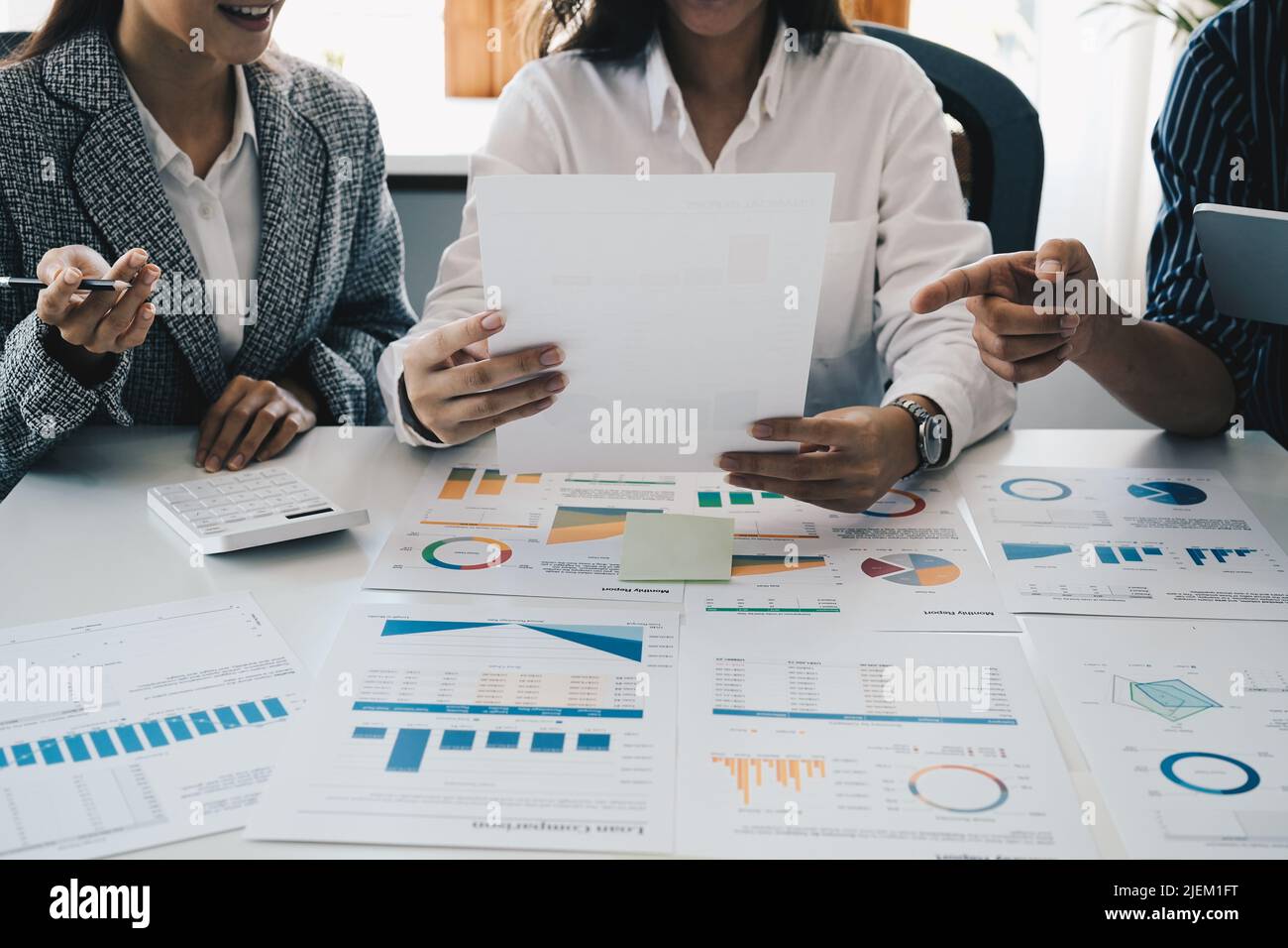 A group of business asian people are meeting to analyze data for marketing plan. accounting financial concept Stock Photo