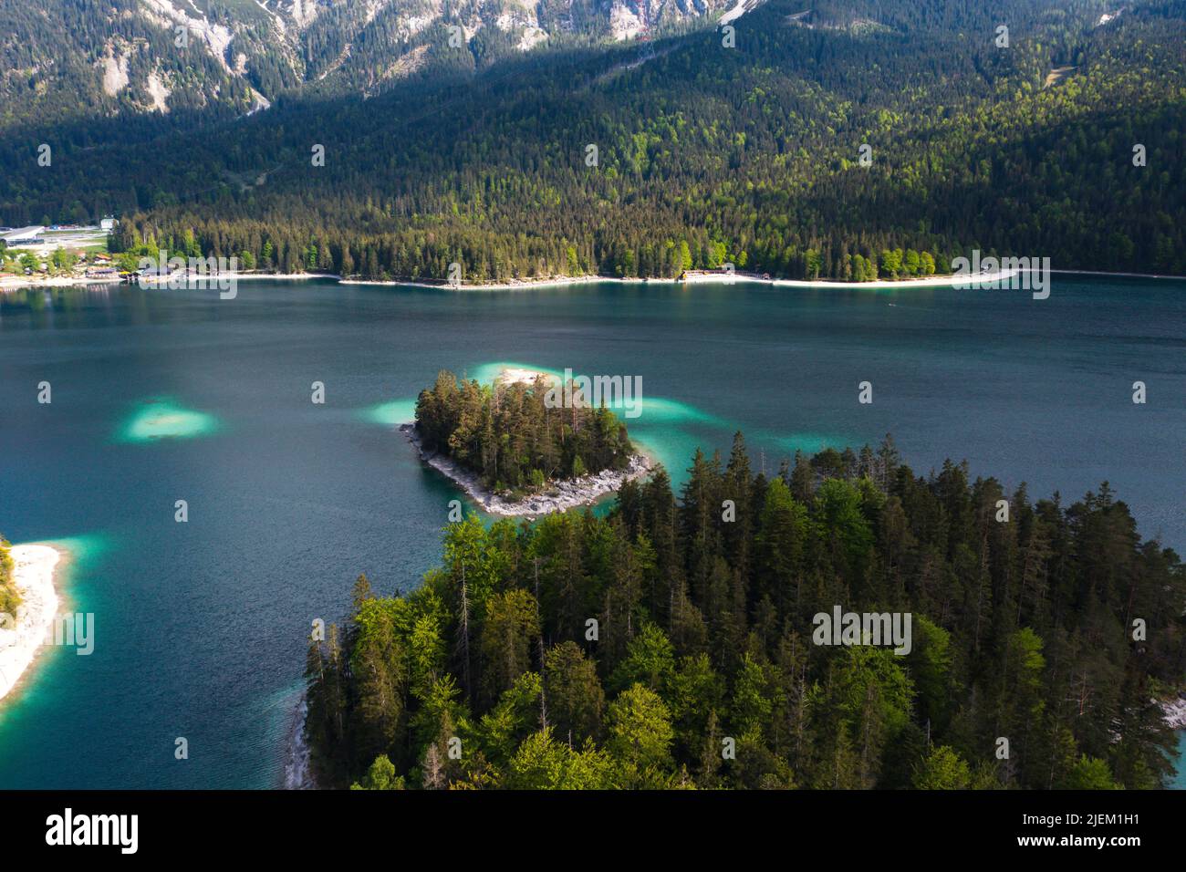 Aerial landscape of Eibsee Lake with turquoise water in front of ...