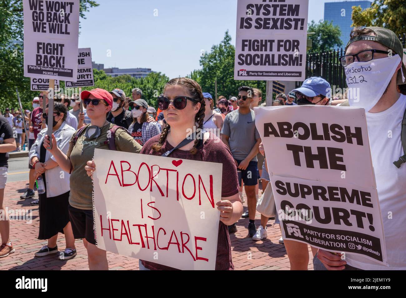Protests holding pro-abortion signs at demonstration in response to the Supreme Court ruling overturning Roe v. Wade. Stock Photo