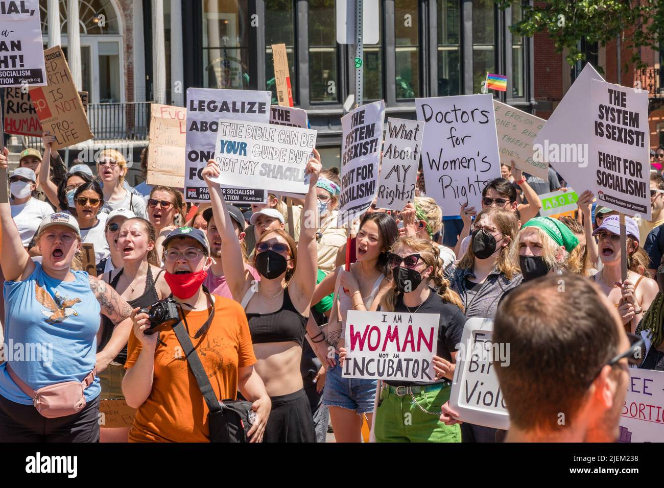 Protests holding pro-abortion signs at demonstration in response to the Supreme Court ruling overturning Roe v. Wade. Stock Photo