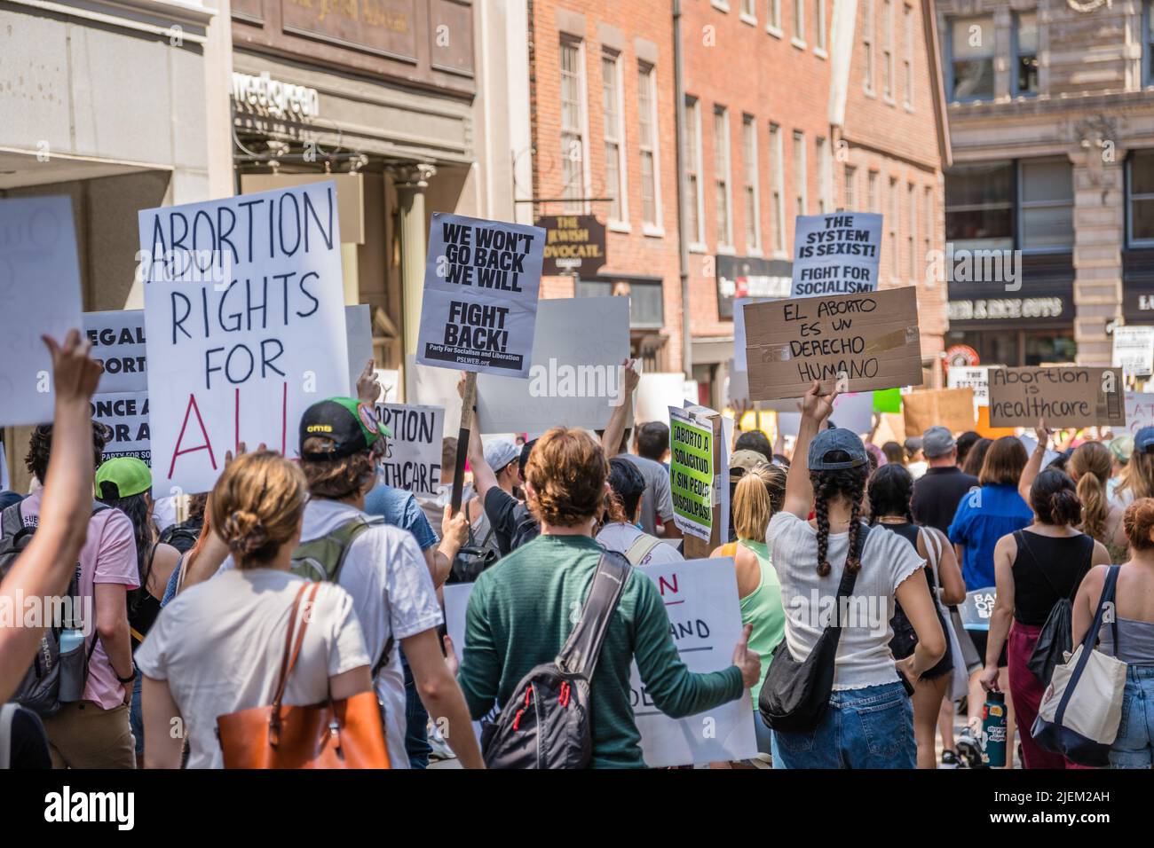 Protests holding pro-abortion signs at demonstration in response to the Supreme Court ruling overturning Roe v. Wade. Stock Photo