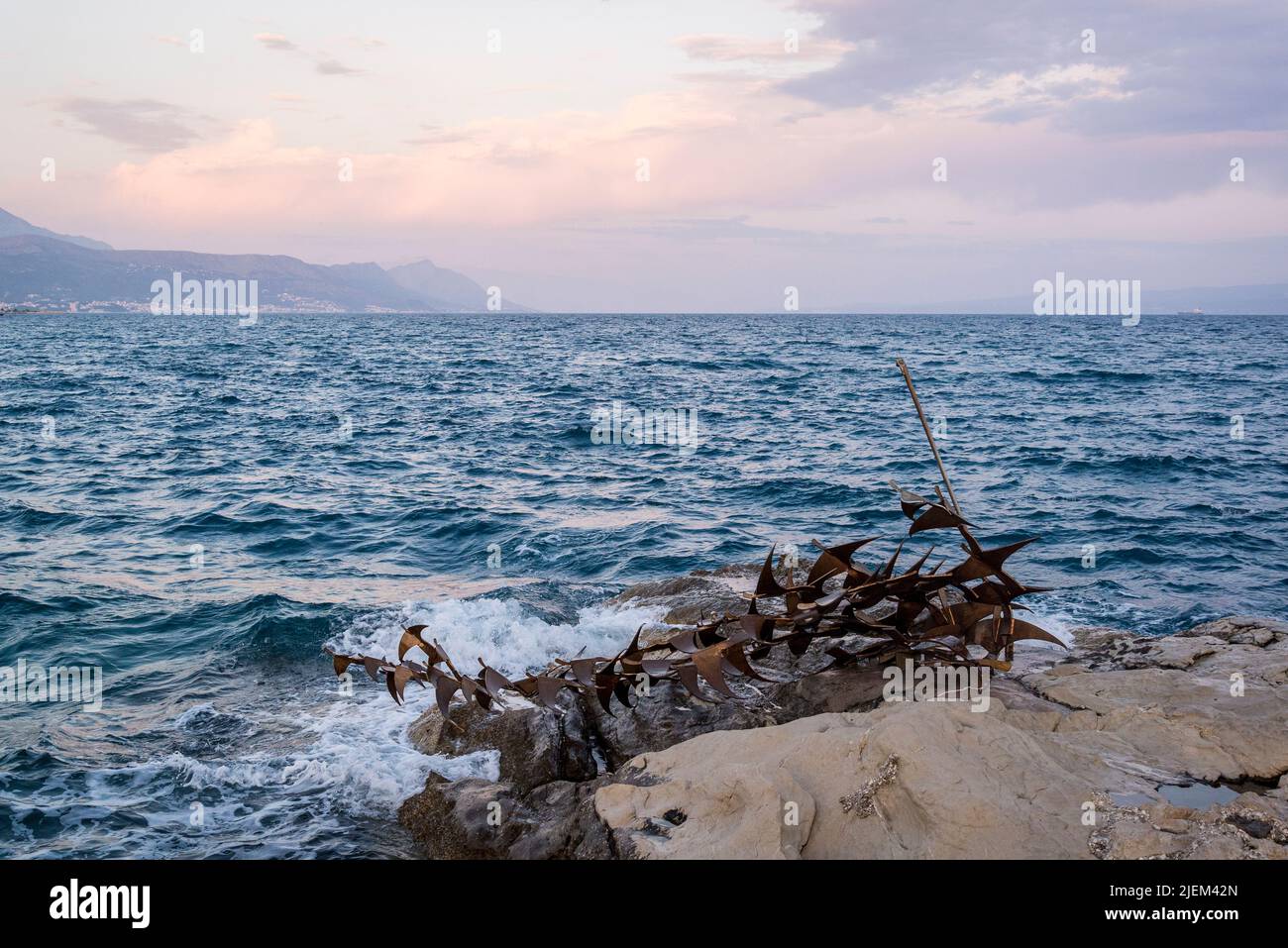 Modern sculpture of a shipwreck on the shore of Adriatic Sea, Split, Croatia Stock Photo