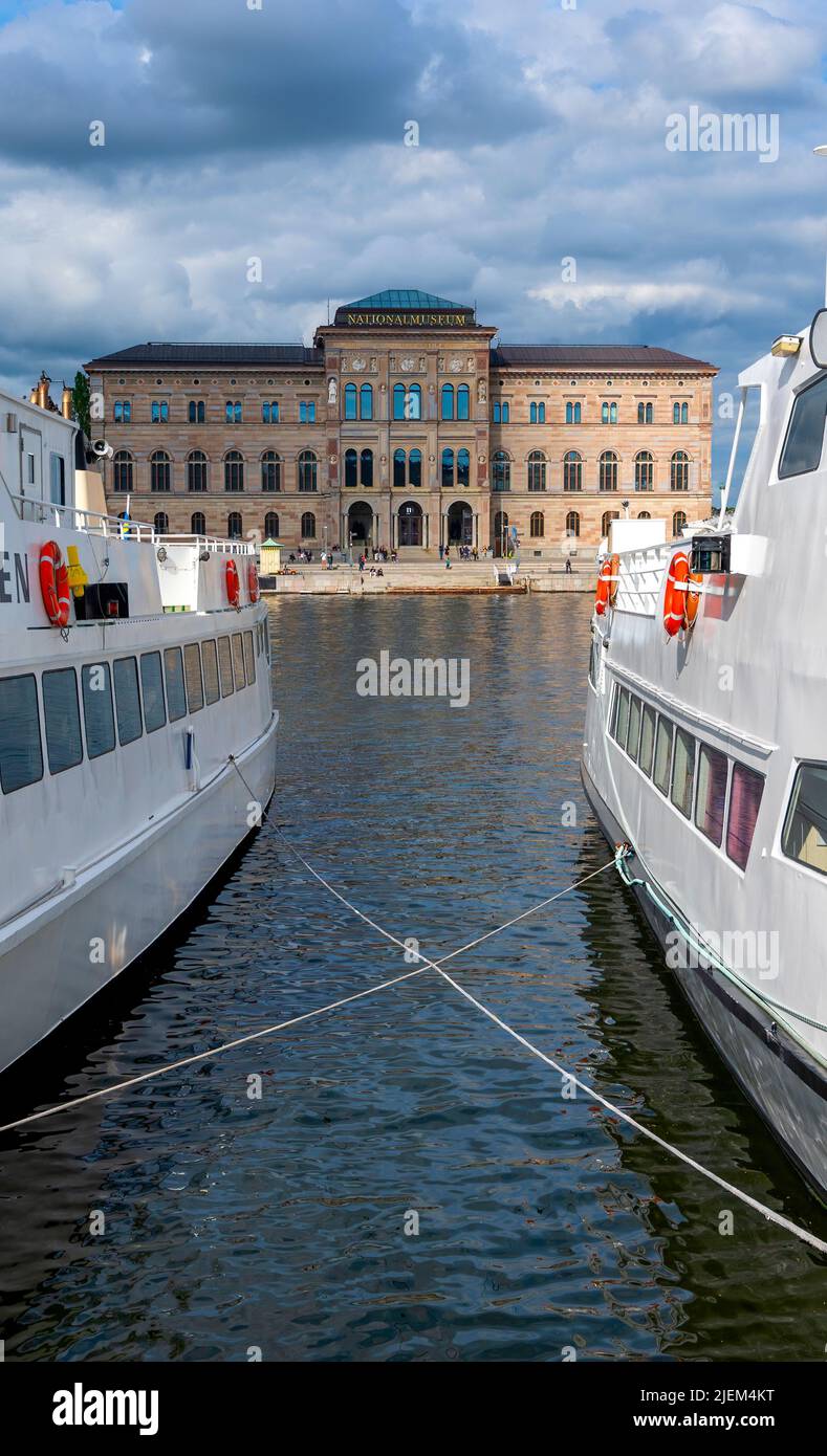 view through the gap between two exursion ships onto the national museum at the Norrstroem in Stockholm, Sweden Stock Photo