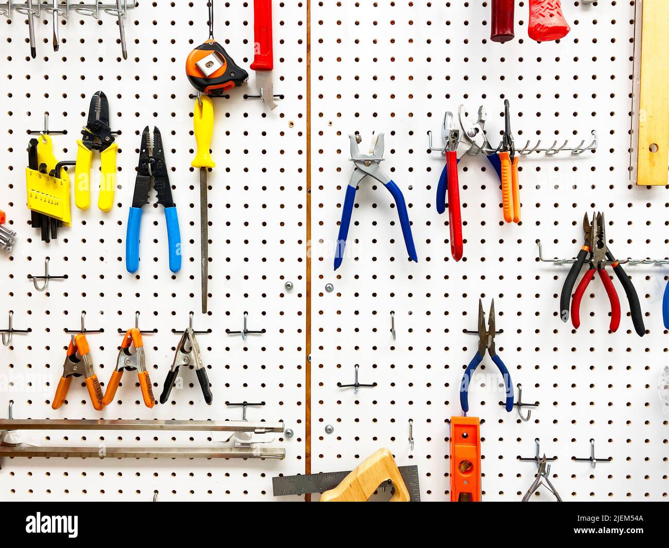 Tools hanging on a pegboard Stock Photo Alamy