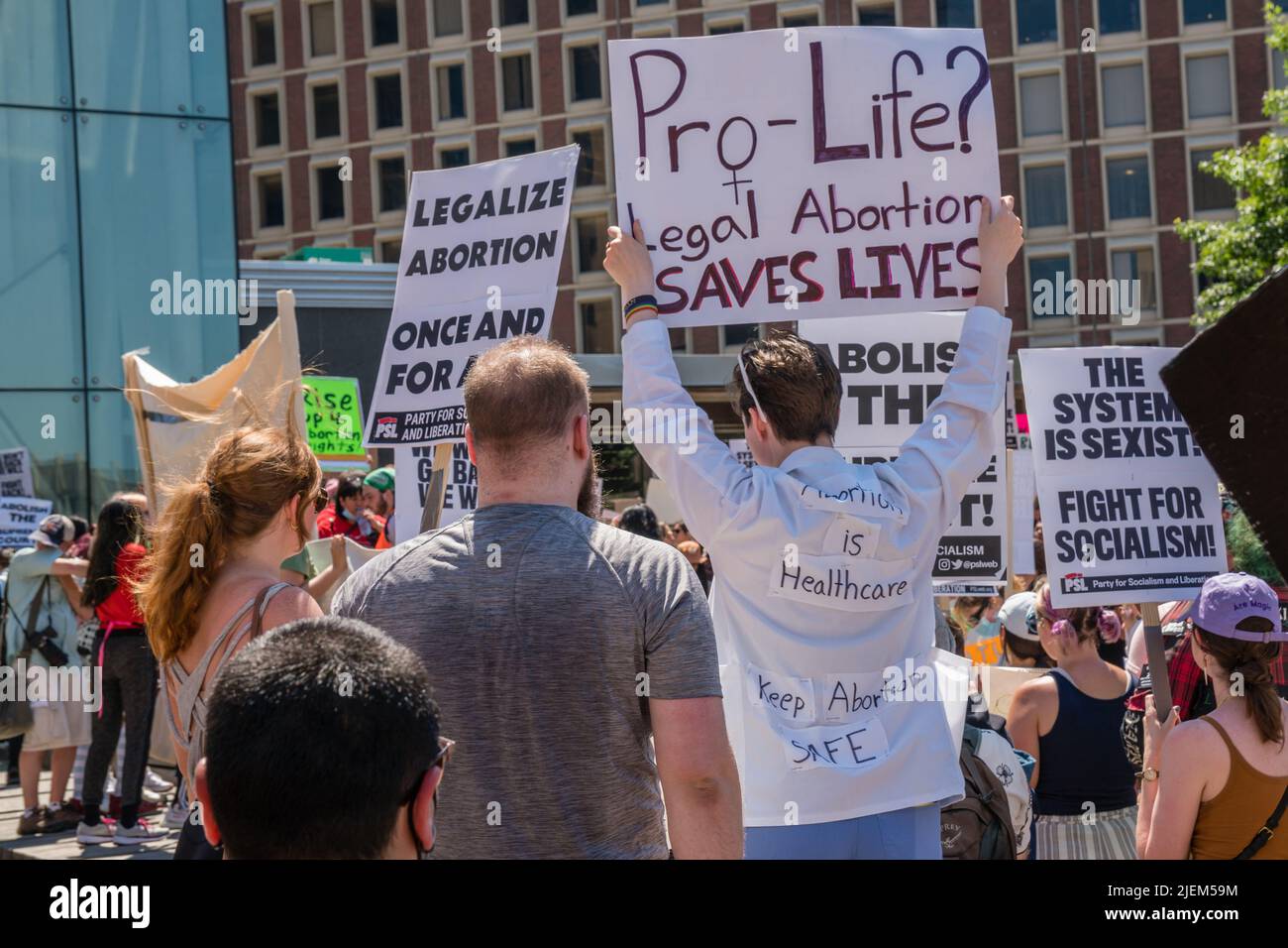 Protests holding pro-abortion signs at demonstration in response to the Supreme Court ruling overturning Roe v. Wade at the Massachusetts State House Stock Photo