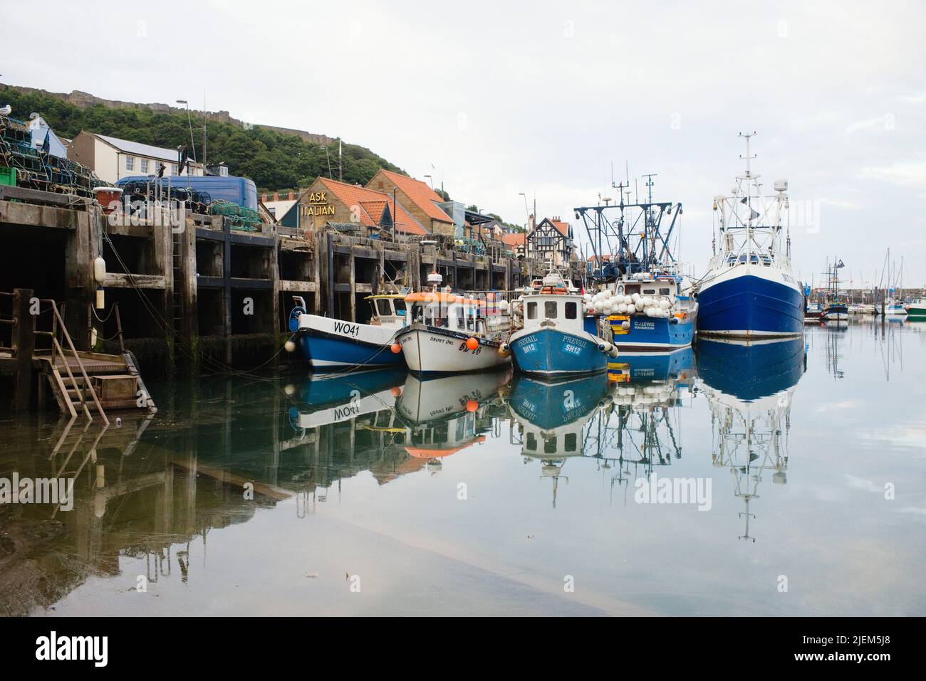 Fishing boats moored alongside the quay in Scarborough harbour Stock Photo