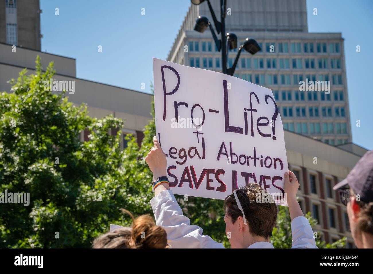Protests holding pro-abortion signs at demonstration in response to the Supreme Court ruling overturning Roe v. Wade at the Massachusetts State House Stock Photo