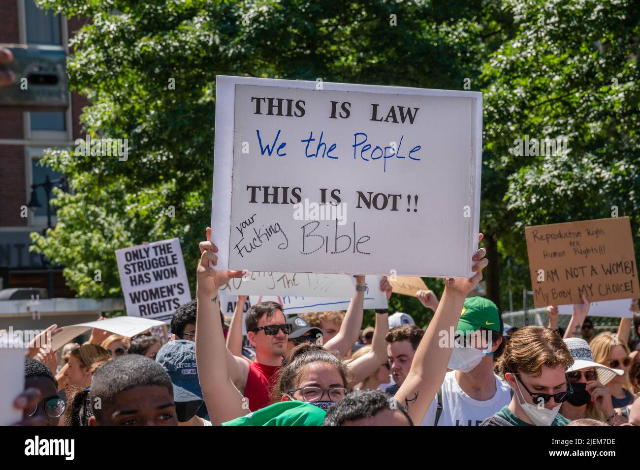 Protests holding pro-abortion signs at demonstration in response to the Supreme Court ruling overturning Roe v. Wade at the Massachusetts State House Stock Photo