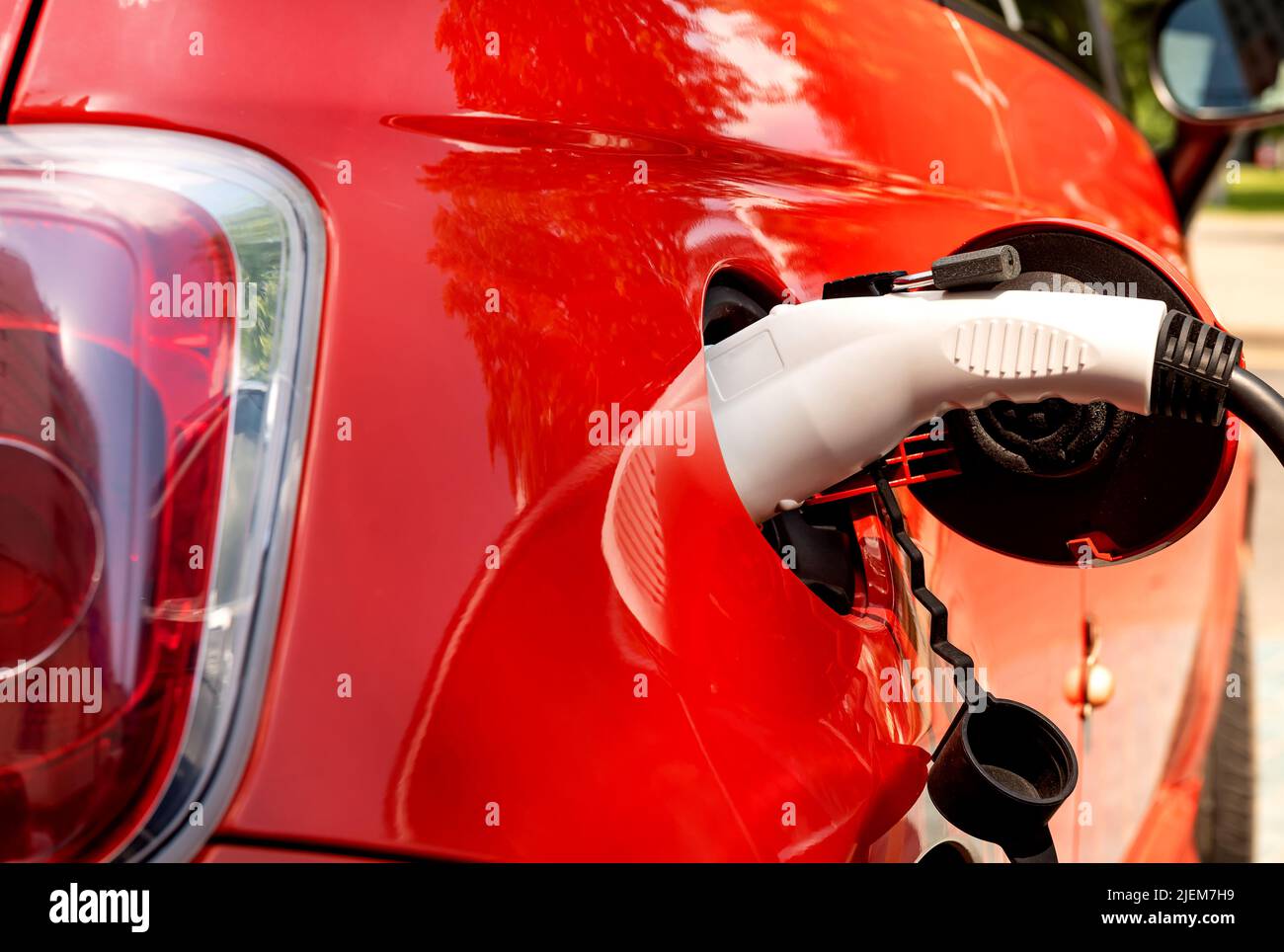 Electric car at the charging station. Ecology. Eco-friendly transport ... - Luxury Eco Properties With Electric Car Charging