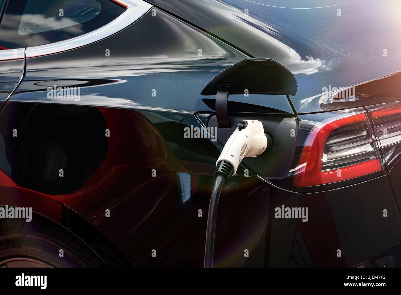 Electric car at the charging station. Ecology. Eco-friendly transport ...