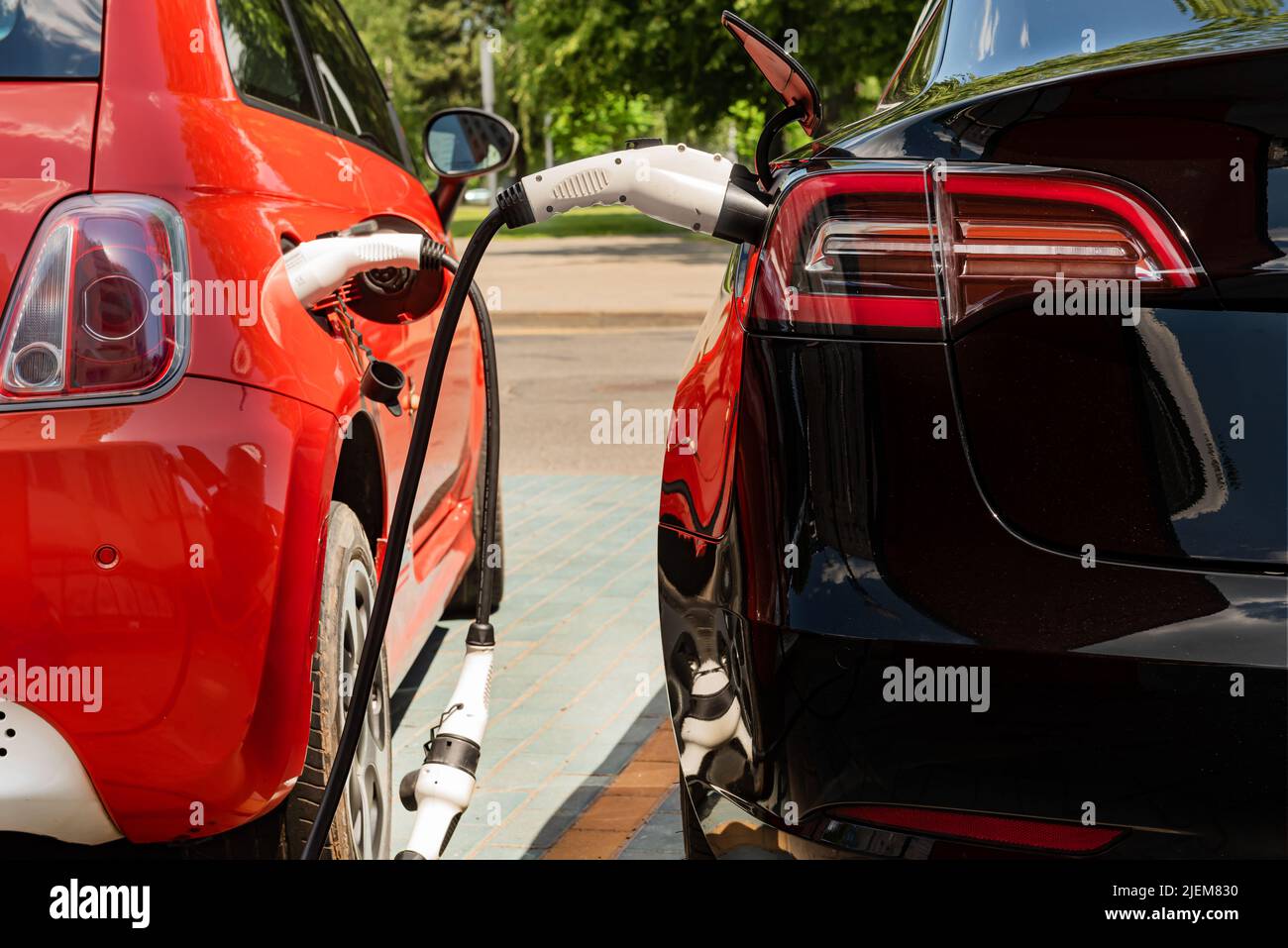 Electric car at the charging station. Ecology. Eco-friendly transport ...