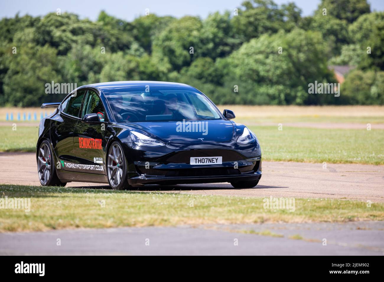 A Tesla Demonstrator car on the track at Bicester Aerodrome Stock Photo