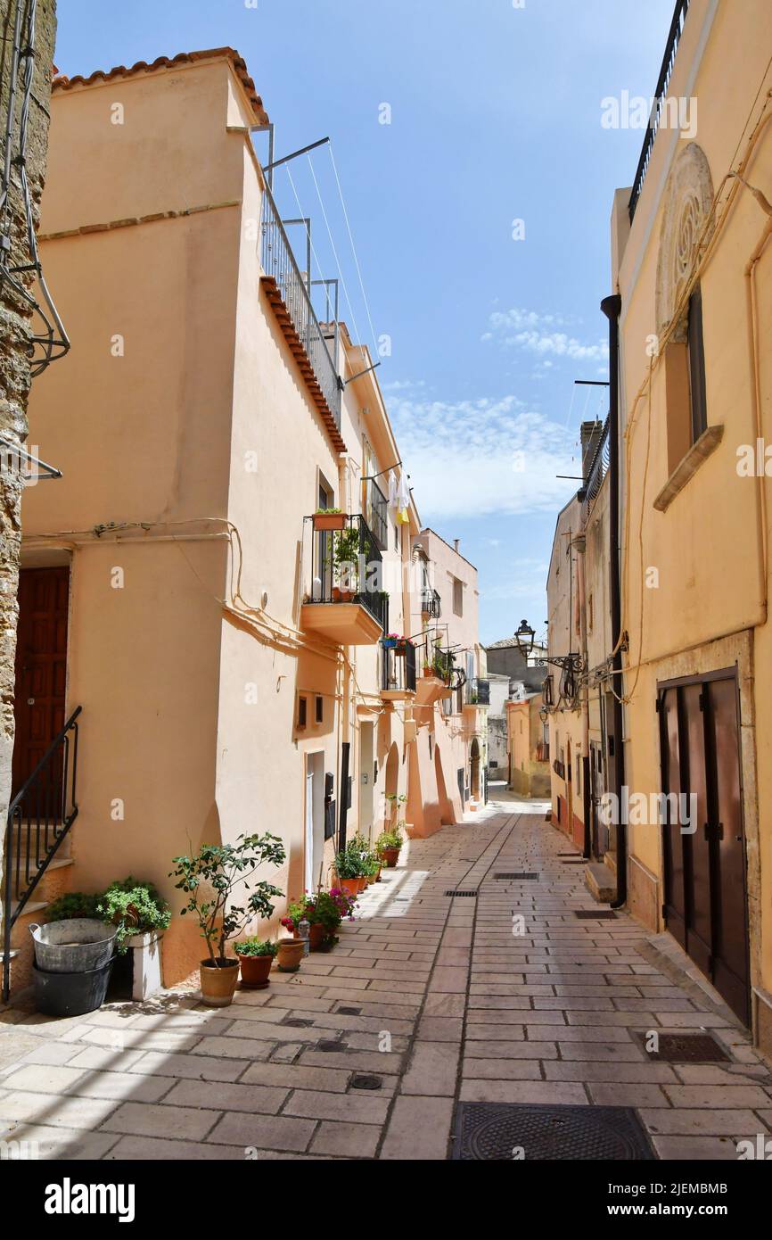 A narrow street among the old houses of Irsina in Basilicata, region in