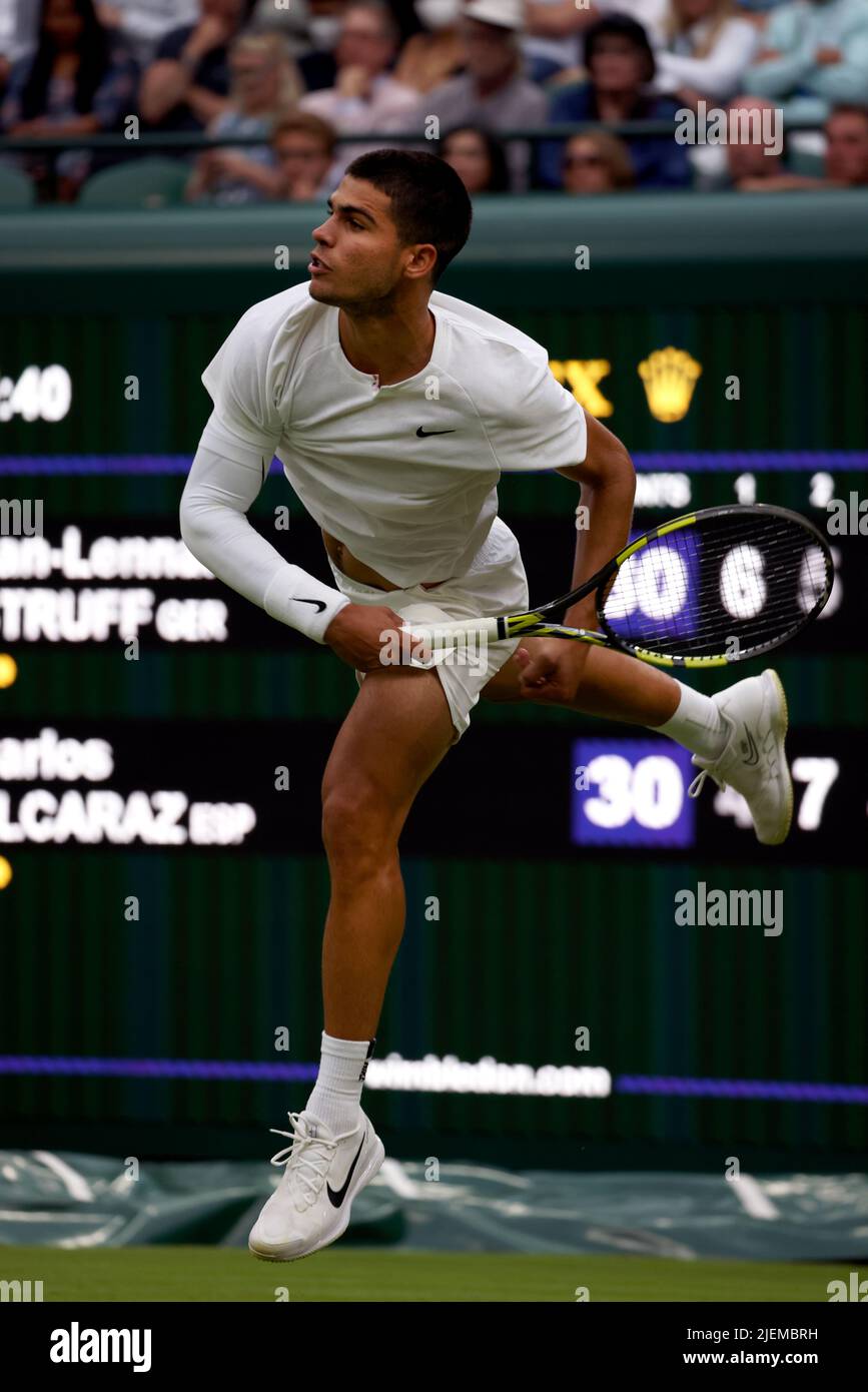 London, 27 June 2022 - Spain's Carlos Alcarraz serving Jan-Leonard STRUFF during their opening round match on Court Number One at Wimbledon today. Credit: Adam Stoltman/Alamy Live News Stock Photo