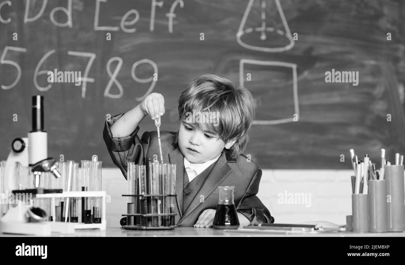 little boy at lesson. Back to school. Little boy is making science