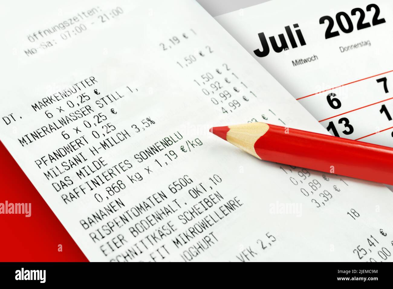 German purchase voucher staple foods with calendar 2022 July and red pencil Stock Photo