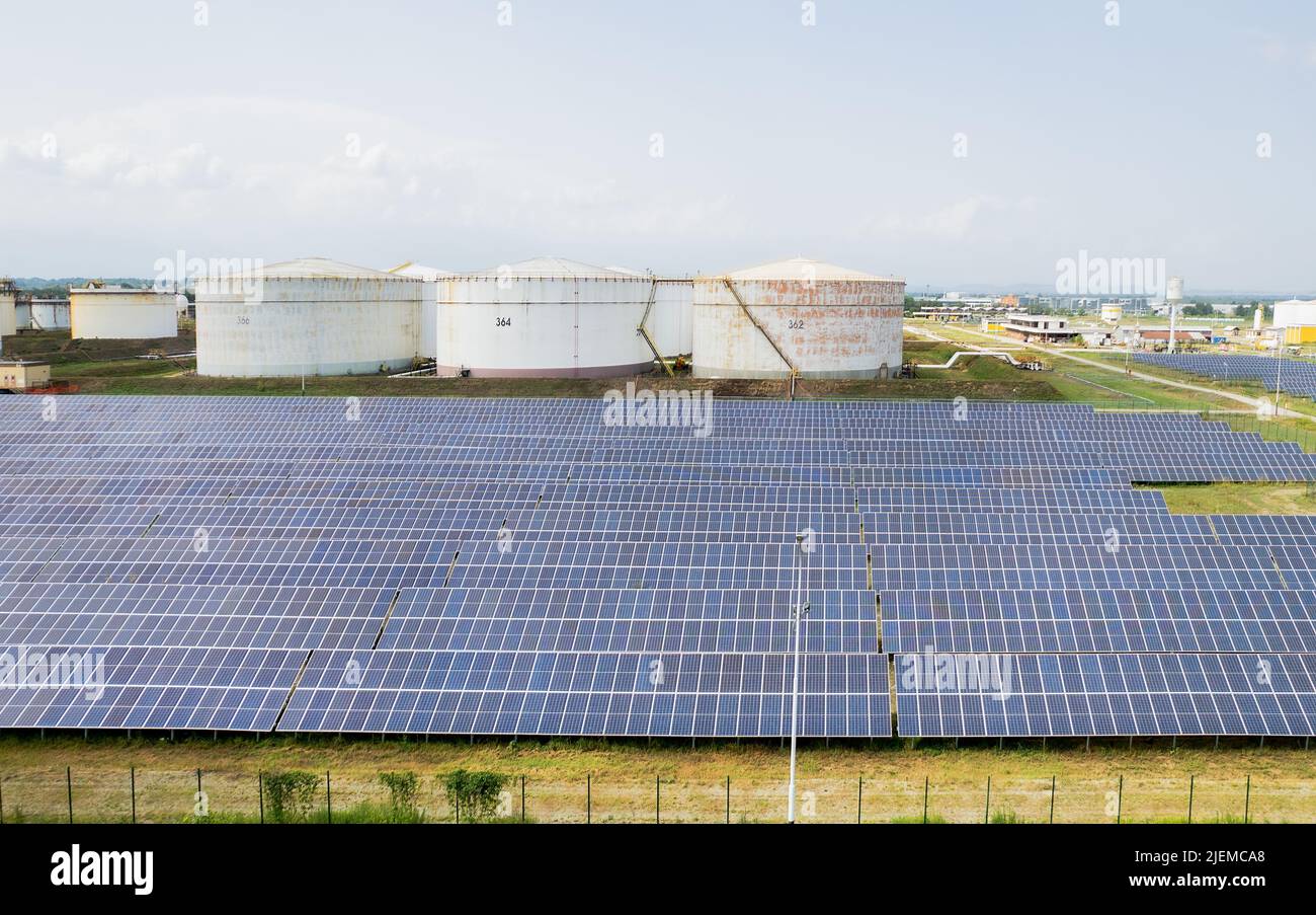 Fuel storage tank and solar farm from above. Gas and diesel reserve for emergency use in European Union.  Volpiano, Italy - June 2022 Stock Photo