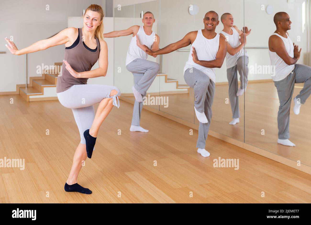 Adult people training dance movements in choreography class Stock Photo