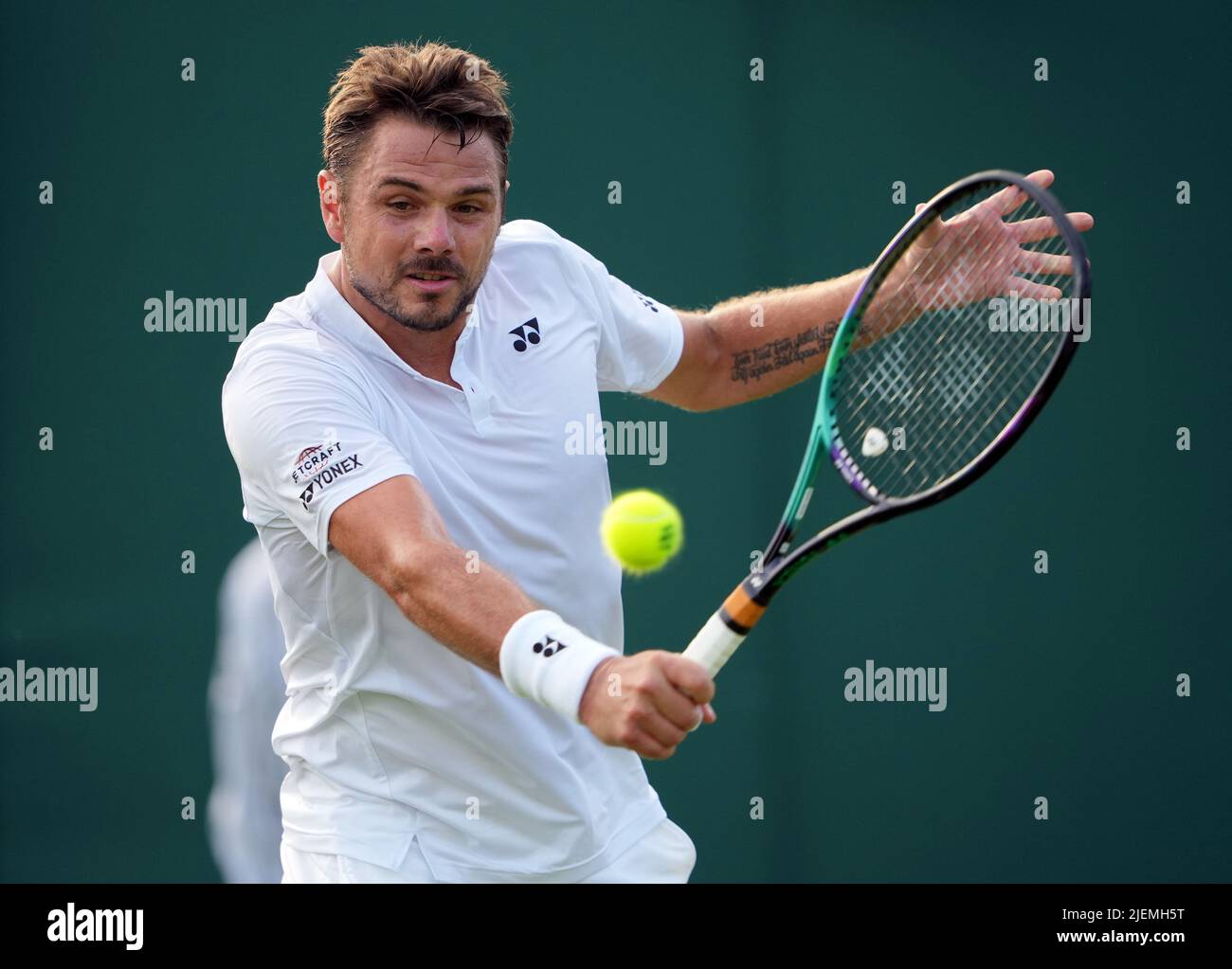 Stan Wawrinka in action against Jannik Sinner on day one of the 2022  Wimbledon Championships at the All England Lawn Tennis and Croquet Club,  Wimbledon. Picture date: Monday June 27, 2022 Stock Photo - Alamy