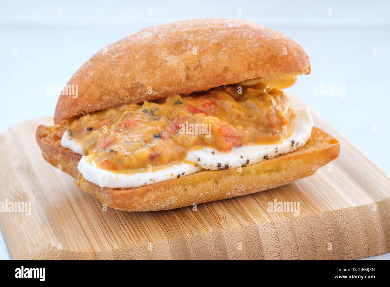 Grilled eggplant mozzarella bruschetta on the wooden plate Stock Photo