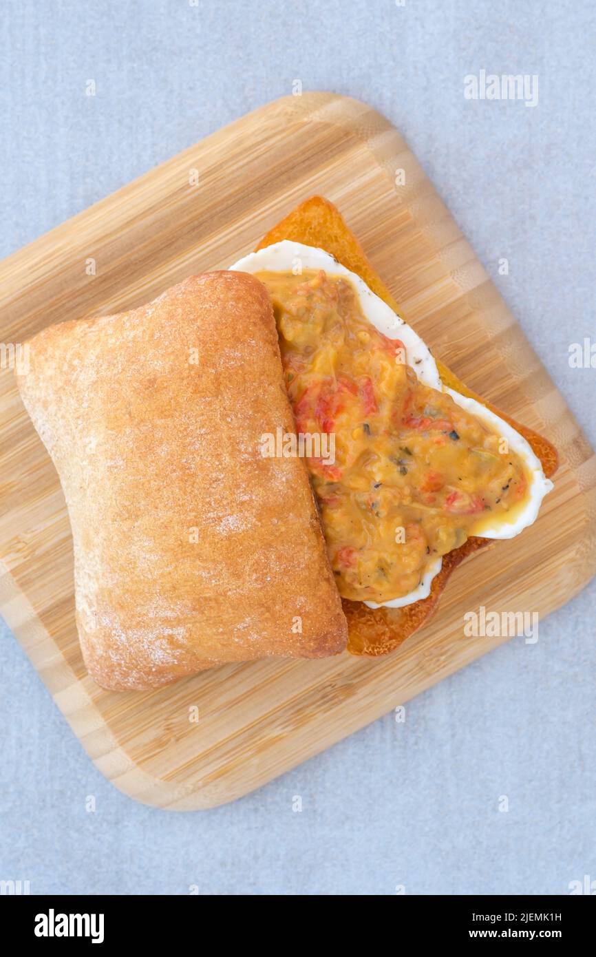 Grilled eggplant mozzarella bruschetta on the wooden plate Stock Photo