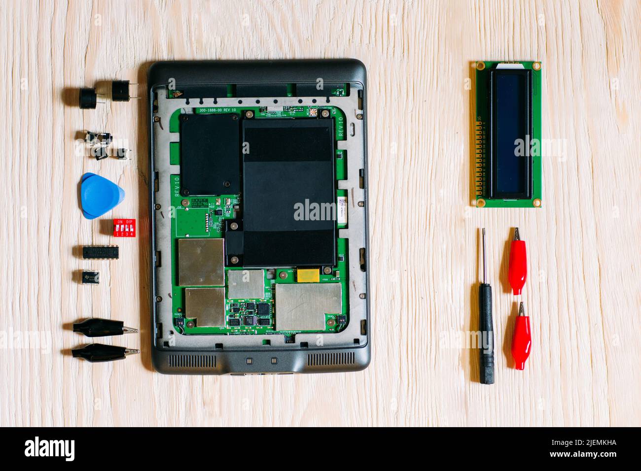 Disassembles tablet on wooden background Stock Photo