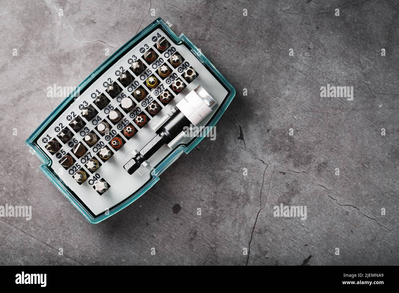 A set of metal bits for screwdrivers in a box. Hexagon head of different sizes Stock Photo