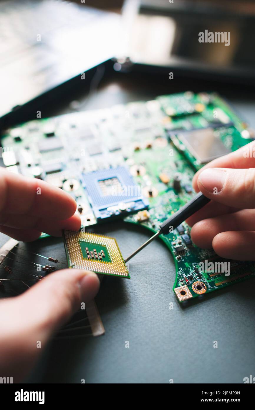Analysis (installing) of processor in CPU socket Stock Photo