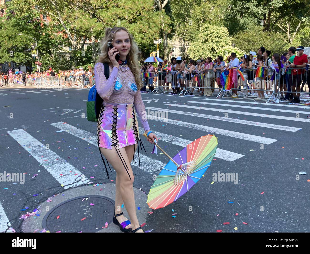 Distracted marcher in the Gay Pride Parade in New York on Sunday, June 26. 2022. The parade was back in full force after being cancelled and scaled back after two years due to COVID-19 restrictions. (© Frances M. Roberts) Stock Photo