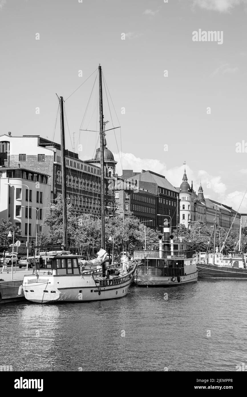 Helsinki, Finland - July 26, 2017: Waterfront with vintage boats by quayside in Helsinki. Black and white photography Stock Photo