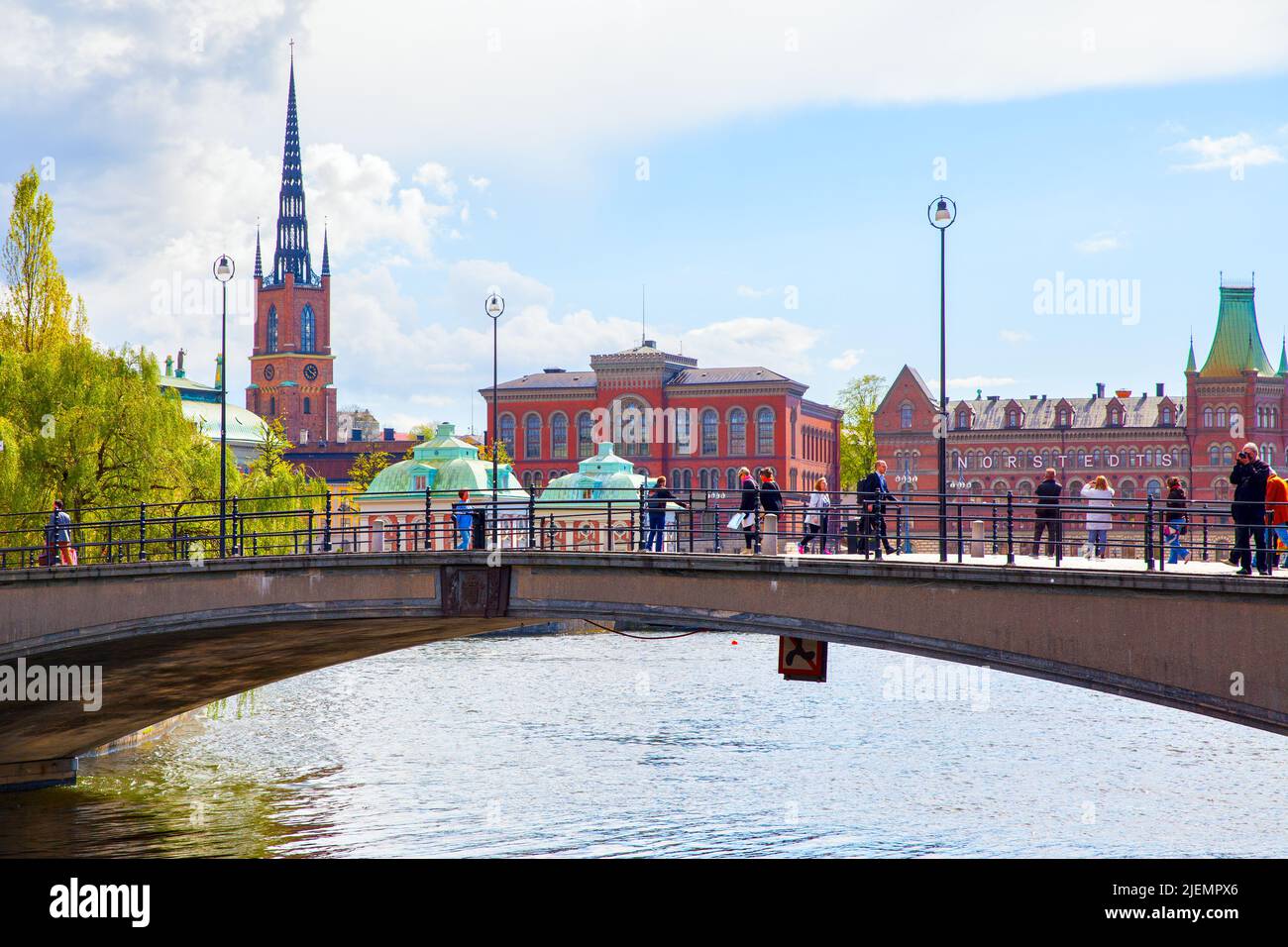 Stockholm, Sweden - May 21, 2015: Pedestrian bridge with walking people in Stockholm Stock Photo