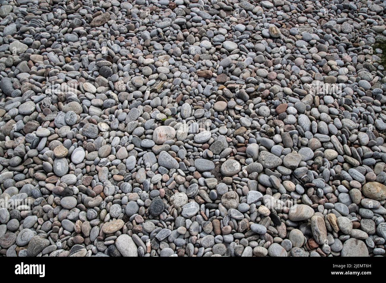 Stones and pebbles smoothed by the forces of the tide on Port Scolpaig , North Uist, where efforts have ben made to manage tidal erosion Stock Photo