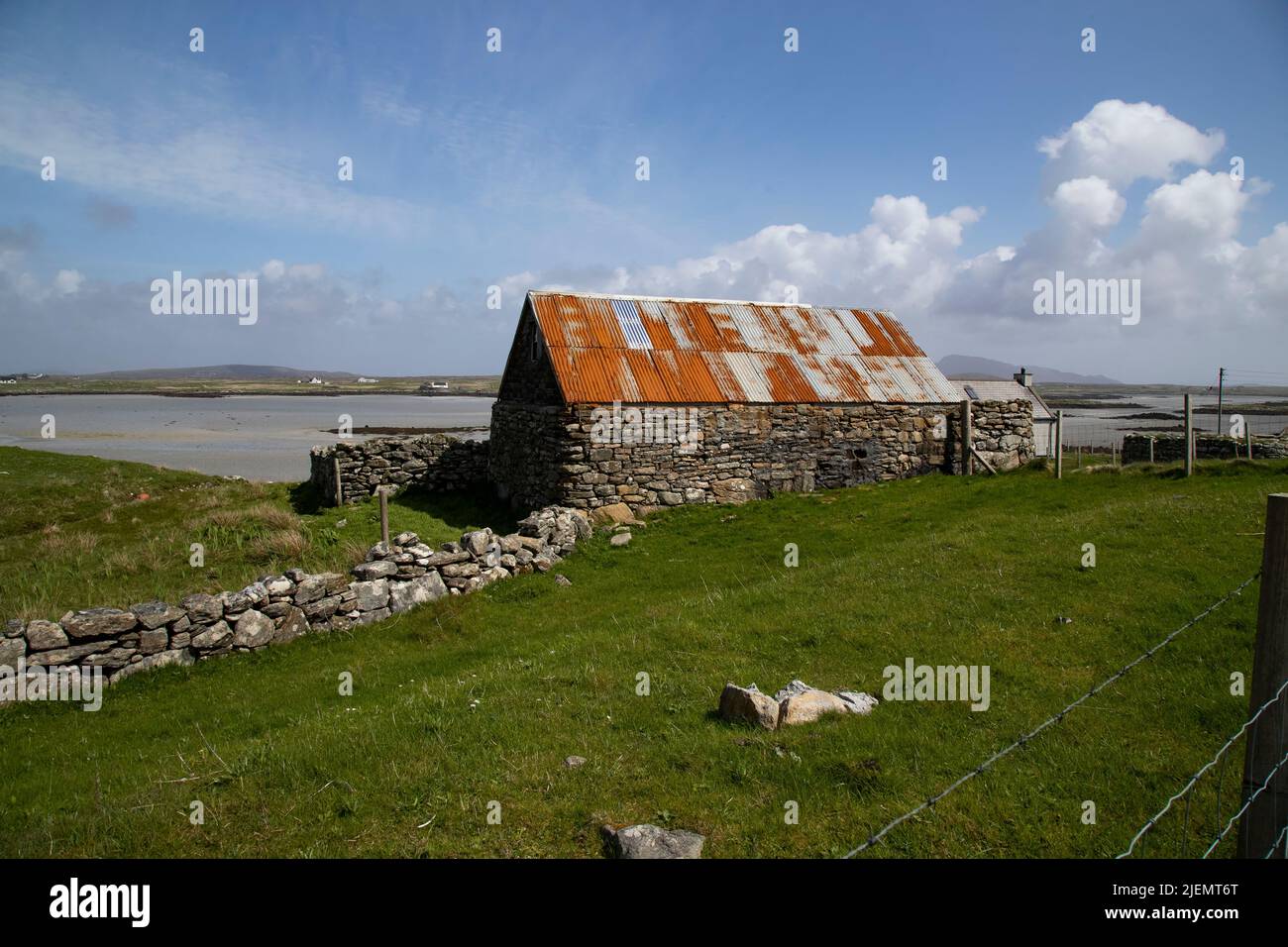 Traditional neglected classic stone Crofters cottage with rusted corrugated iron roof on the Isle of North Uist, Outer Hebrides, Scotland. Stock Photo