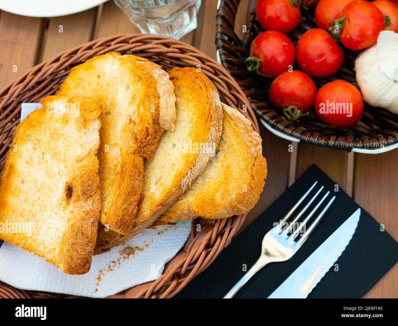 Grilled bread, tomatoes and garlic for Pan con tomate Stock Photo Alamy