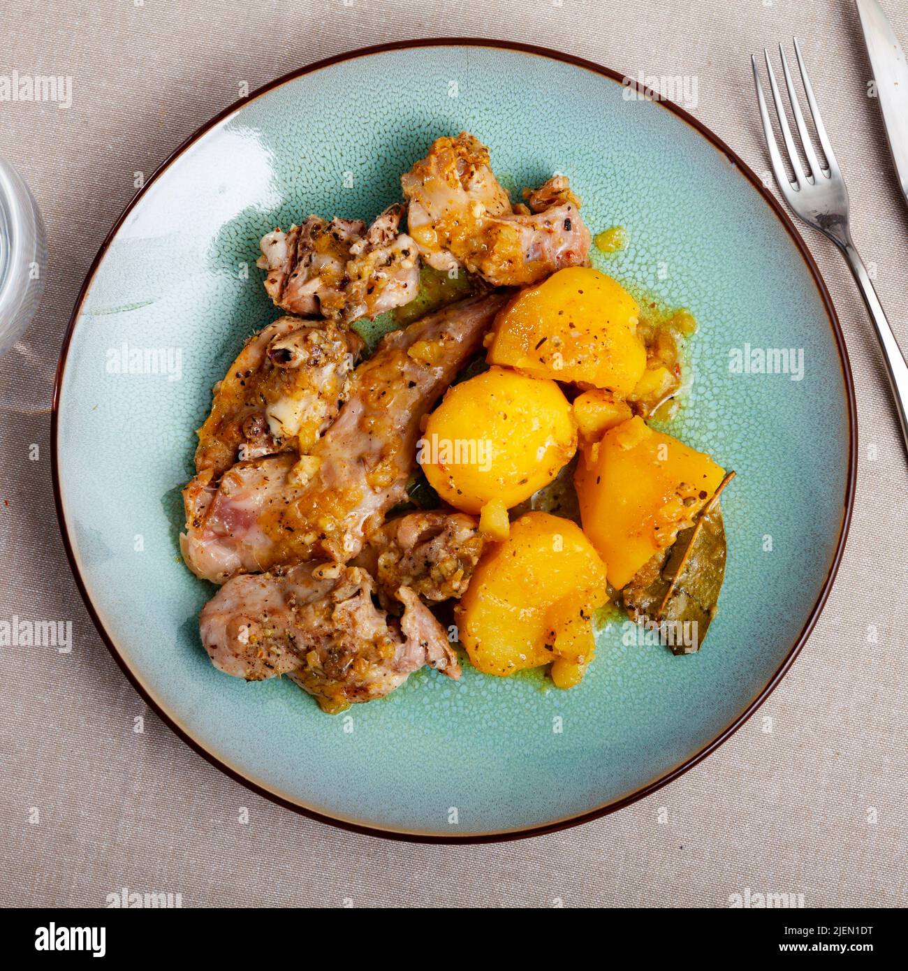 Dish of stewed rabbit and potatoes Stock Photo - Alamy