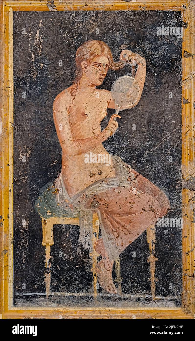 Roman painting of a woman brushing her hair from Villa di Arianna, Pompeii, Italy circa 54-69AD. Stock Photo