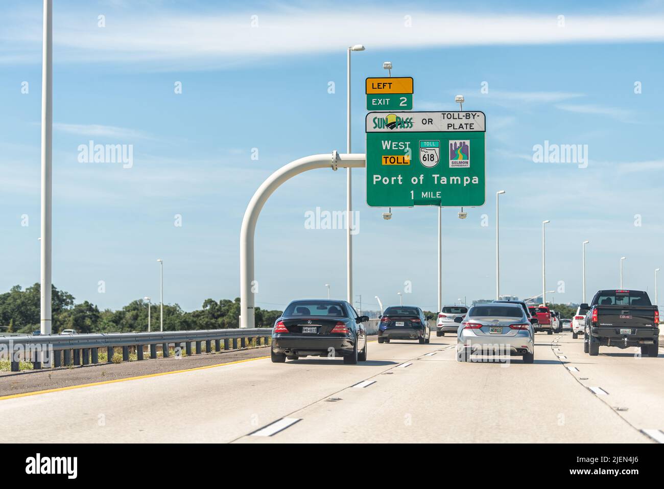 Tampa, USA - October 4, 2021: Road street interstate highway green arrow sign from i75 for Selmon Expressway Sunpass toll exit to Port of Tampa Florid Stock Photo