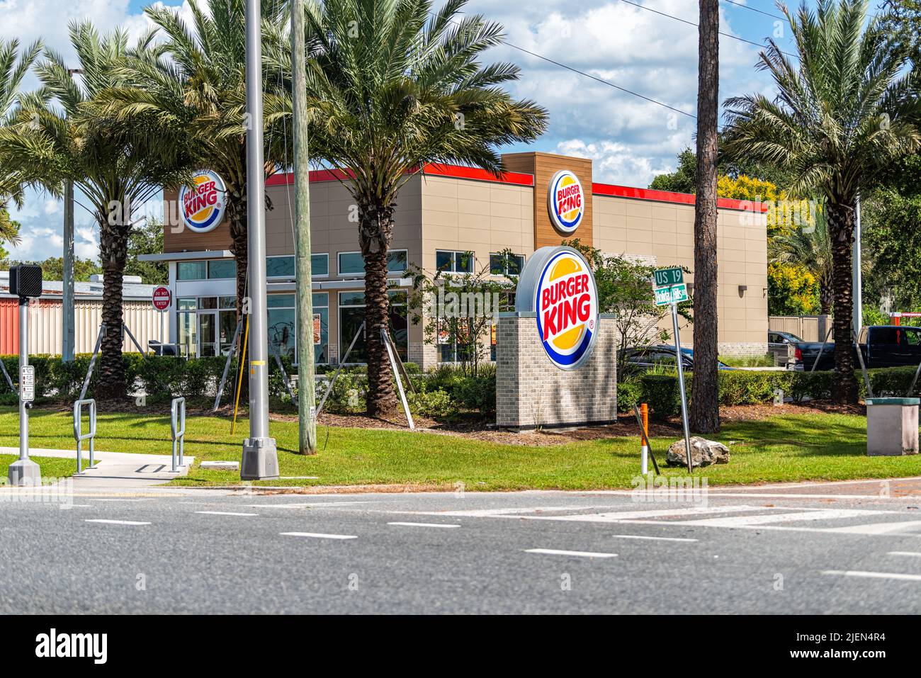 Port Richey, USA - October 4, 2021: Florida city on gulf coast with sign by building for Burger King fast food joint chain restaurant famously known f Stock Photo