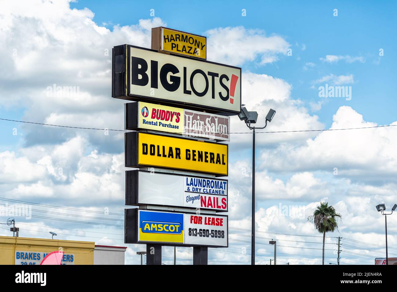 Port Richey, USA - October 4, 2021: Florida city on gulf coast with sign for Big lots cheap discount store for groceries and home goods on Harmony pla Stock Photo