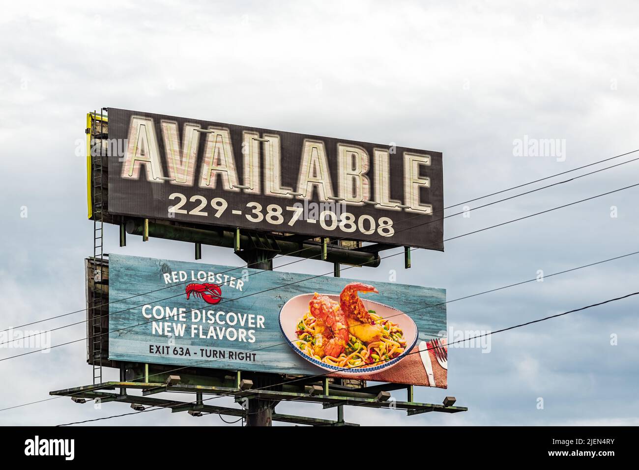 Tifton, USA - October 5, 2021: View of interstate i-75 sign billboard in Tifton, Georgia for available phone number and Red Lobster ad at exit 63a mil Stock Photo
