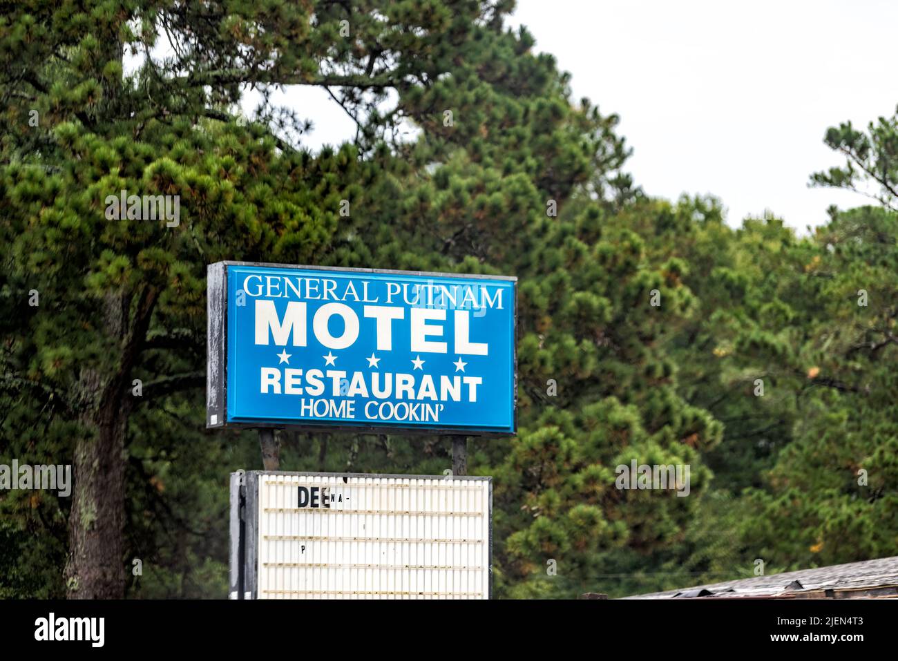 Eatonton, USA - October 5, 2021: Sign closeup in Eatonton, Georgia for General Putnam motel and restaurant home cooking hotel in blue color for perman Stock Photo