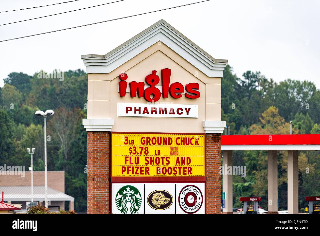 Commerce, USA - October 5, 2021: Commerce, Georgia local chain food store entrance sign for Ingles market grocery shop pharmacy with flu shots and cov Stock Photo