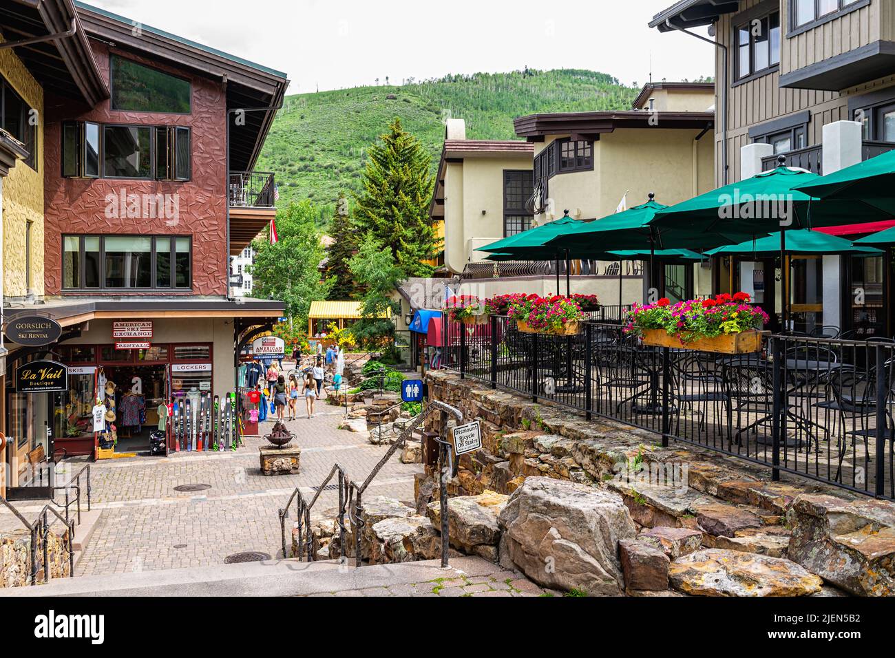 Vail, USA - June 29, 2019: Steps stairs down on Gore Creek drive street with people in shopping area stores shops in Colorado Stock Photo