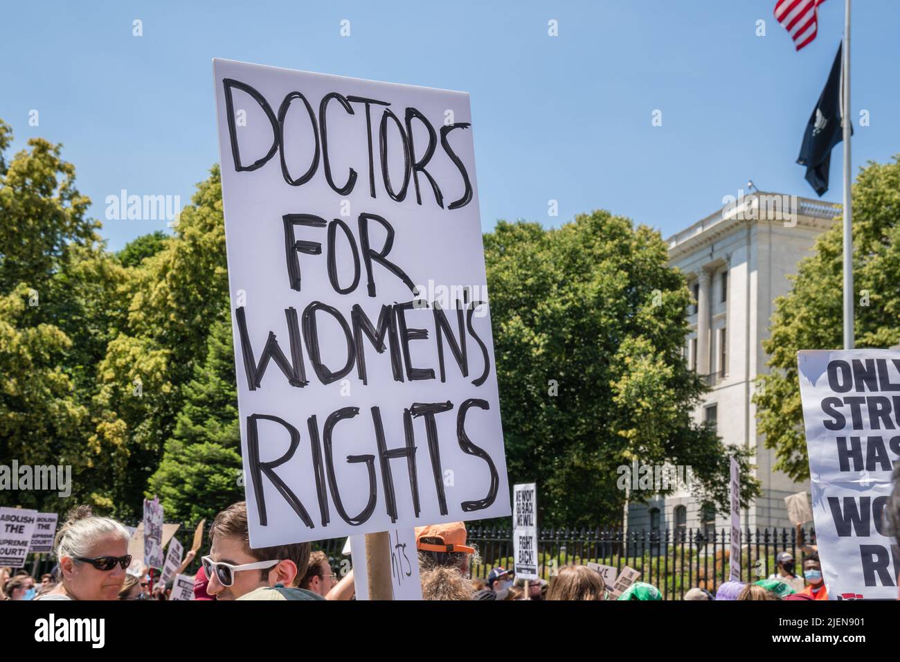 Protests holding pro-abortion signs at demonstration in response to the Supreme Court ruling overturning Roe v. Wade at the Massachusetts State House Stock Photo