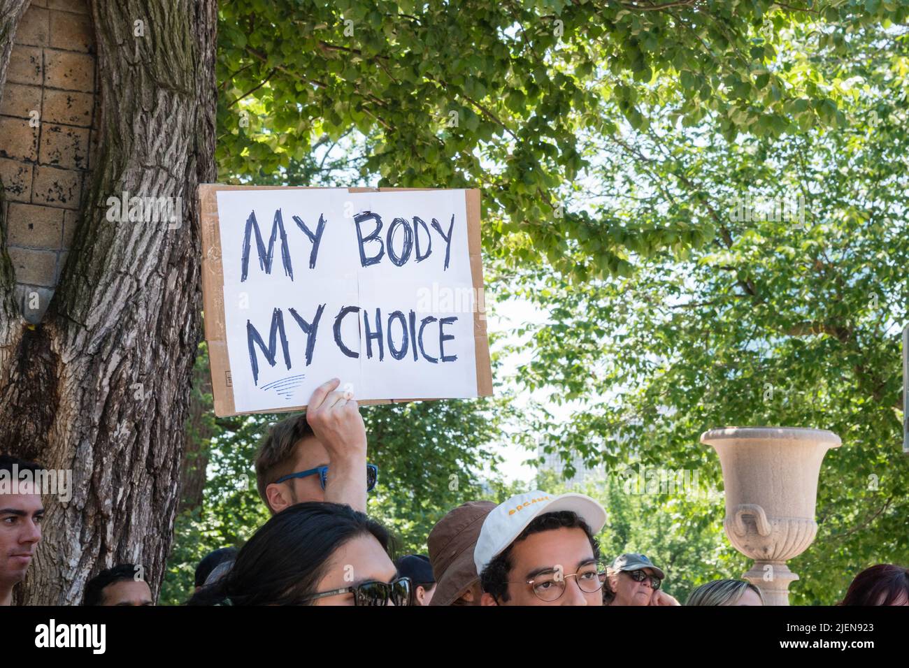 Protests holding pro-abortion signs at demonstration in response to the Supreme Court ruling overturning Roe v. Wade at the Massachusetts State House Stock Photo