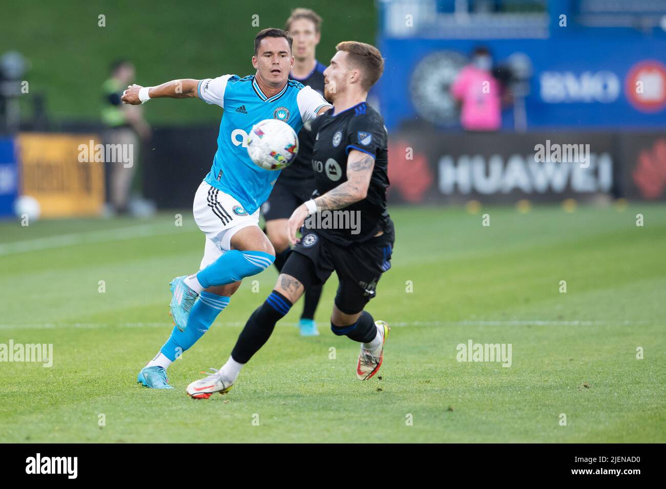 Montreal, Canada. 25th June, 2022. Charlotte FC Koa Santos (36) and CF Montreal Joel Waterman (16) battle for the ball during the MLS match between Charlotte FC and CF Montreal held at Saputo Stadium in Montreal, Canada. Daniel Lea/CSM/Alamy Live News Stock Photo