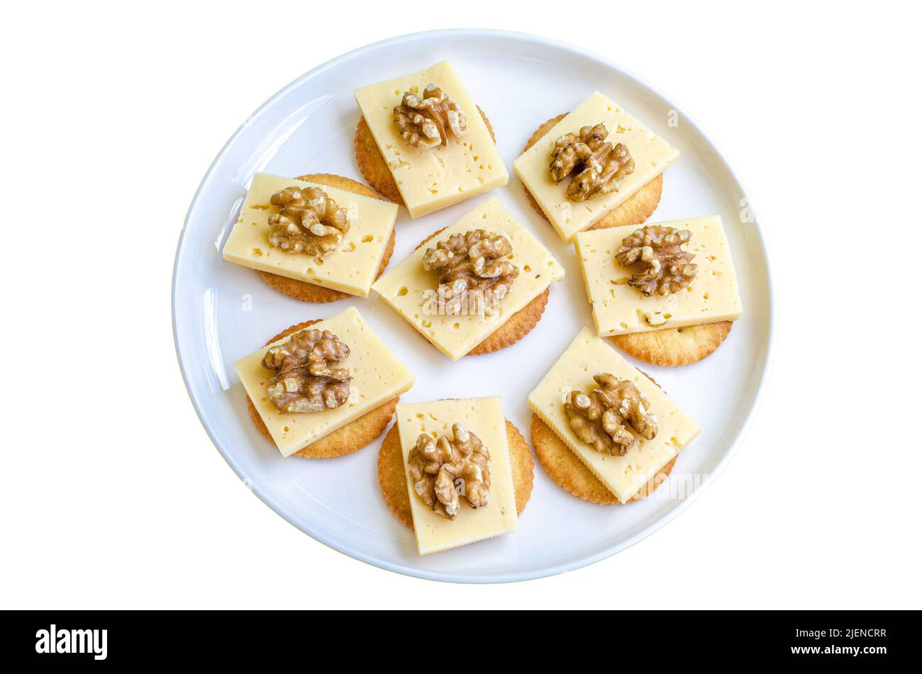 Round Buttery Cracker with Creamy Cheddar Cheese with Nuts On Plate Isolate Stock Photo