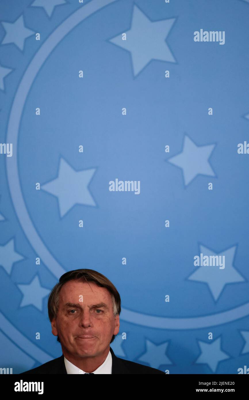 Brazil?s President Jair Bolsonaro reacts during a ceremony to announce a new document identification system and to launch the new Brazilian passport at the Planalto Palace in Brasilia, Brazil June 27, 2022. REUTERS/Ueslei Marcelino Stock Photo