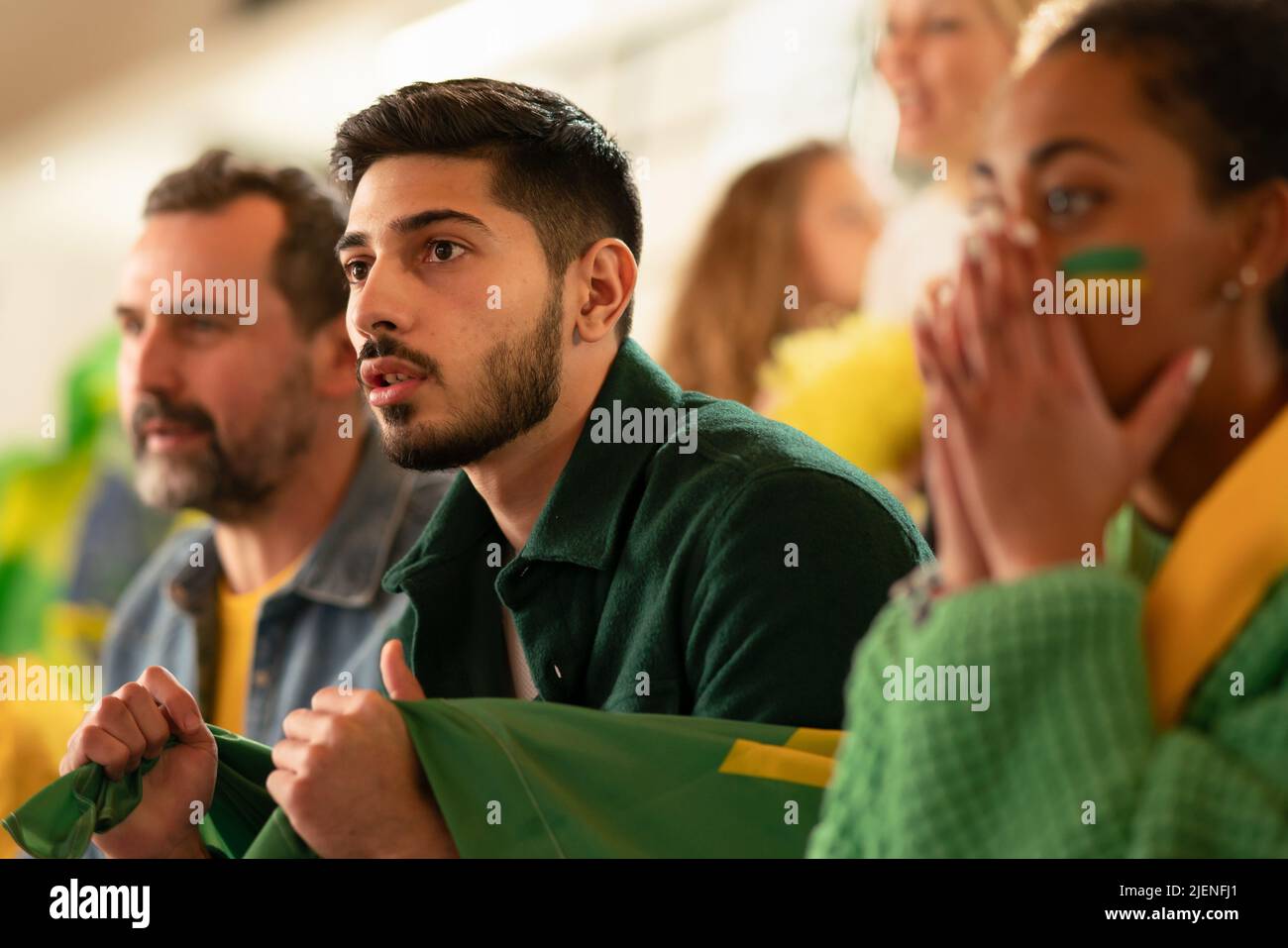A brazilian football fans supporting their team at a stadium. Stock Photo